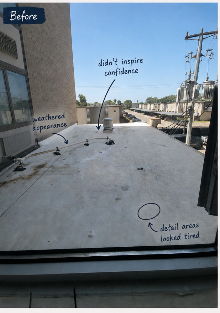 Weathered existing low-slope roof above the mechanical room before the TPO reroof