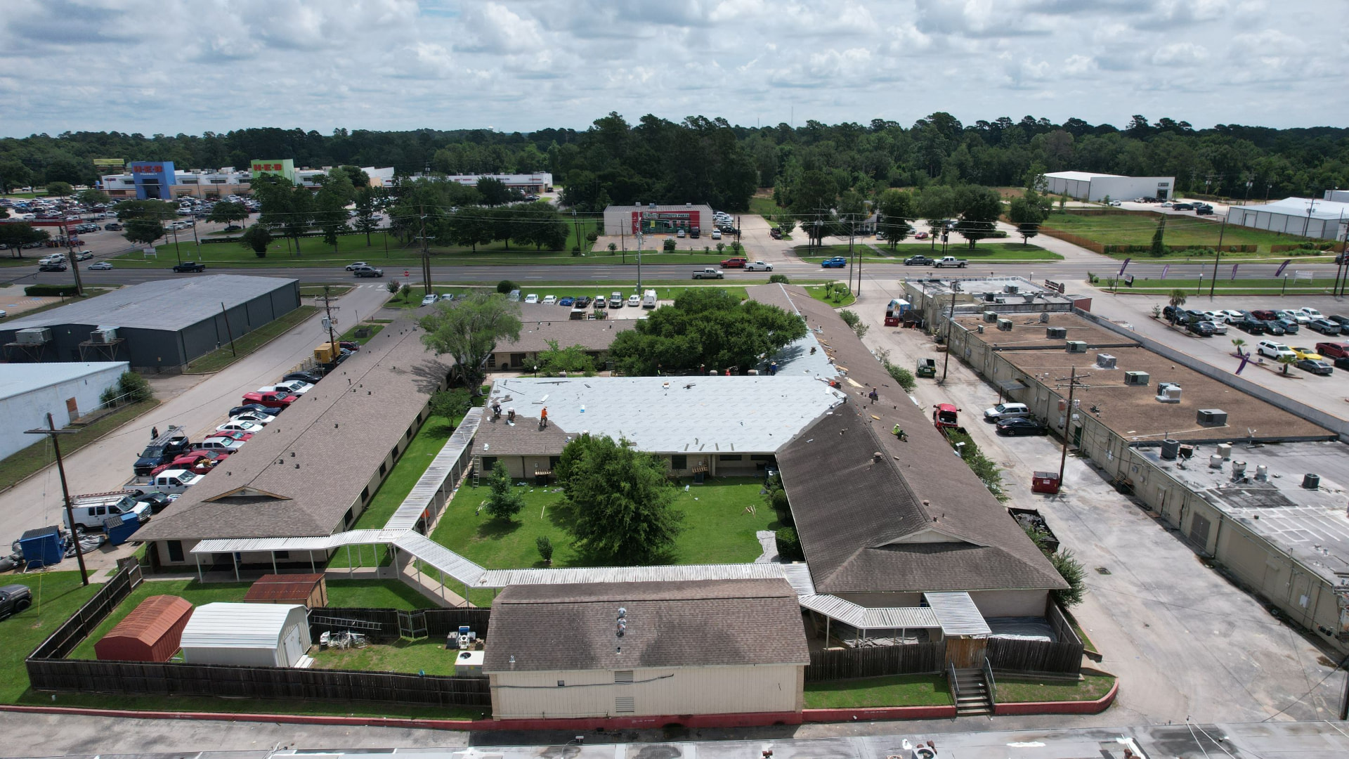 Aerial view of Conroe Health Care Center during tear-off, before the new roof system was installed